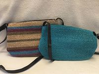 Front view of both knit crossbody bags showing colors and straps