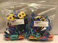 Two sealed bags of multicolour magnetic foam letters and numbers