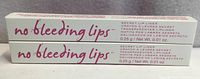 Front view of both boxed lip liners showing product name and weight