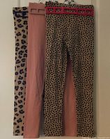 All three leggings hung front view