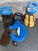 All three toys standing with packaging visible