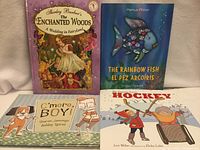 Group shot of four children’s books