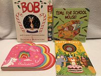 All four board books standing: Bob, Time for School Mouse, Party Time, Heartfelt Unicorn Love
