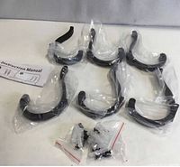 Six individually bagged black hooks, screws, anchors and instruction manual