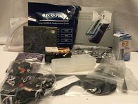 Entire assortment showing cable, screen protector, face mask, CD and other items