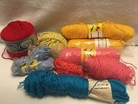 Group shot of all yarn skeins and ball