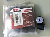 Sealed bag showing FurniGear Furniture Caps packaging