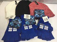 Lot overview showing three beanies and four Doctor Who gloves with tags