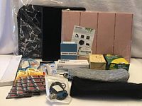 Group shot of entire lot showing binders, folders, boxed items, flash drives, tools and pouches