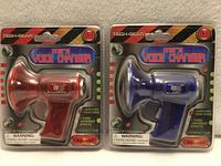 Front view of both packaged voice changers showing colors and branding