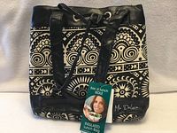 Front view of patterned insulated lunch bag with tag attached