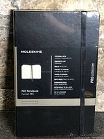 Front of sealed Moleskine Pro Notebook showing branding and elastic closure
