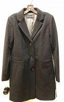 Front view of black Nuage jacket on hanger