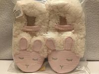 Front view showing bunny faces and plush material