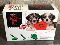 Front of sealed Pet Pull grooming kit box