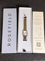 Watch in open box with outer sleeve and paperwork