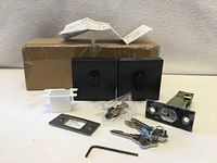 All contents of both deadbolt sets with boxes