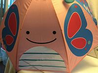 Umbrella canopy showing butterfly design