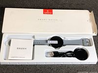Watch, charger, manual in box