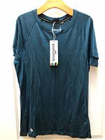 Front view of twilight blue Smartwool women’s short-sleeve T-shirt with hang tag