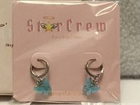 front view of earrings on StarCrew card