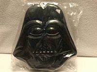 Front view of sealed Darth Vader tin wallet