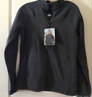Front view of jacket with hang tag visible