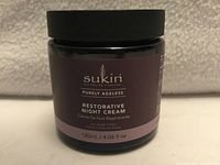 Front of Sukin Purely Ageless Restorative Night Cream jar, showing product name and size