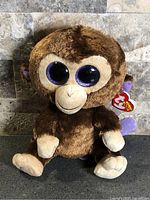 Front view of Ty Beanie Boos brown monkey plush with tag