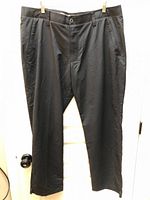 Front view of black Under Armour men’s pants