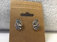 Front view of unicorn stud earrings on card