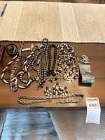 Overview of entire jewelry lot on table