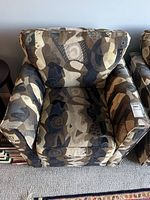 Front view of patterned swivel armchair