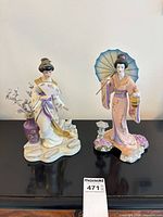 Both porcelain geisha figurines full view