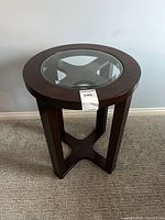 Full view of side table showing glass inset and overall design