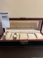 Open watch box showing two Seiko watches inside