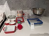 All items grouped on countertop showing variety of storage and bakeware pieces