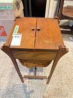 Angled view showing top closed, side supports and fabric pouch