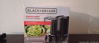 Front of sealed BLACK+DECKER Fresh Prep chopper box showing model and capacity