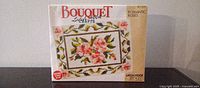 Front of sealed Bouquet Romantic Roses latch hook kit box