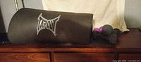 Rolled Tapout mat with all dumbbells visible