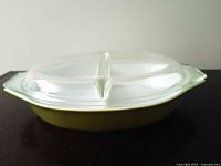 top view showing divided glass lid on green casserole