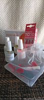 Full lot showing press-on kit box, four AIJMEI bottles and pouch with files