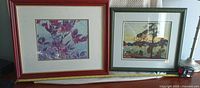 Frontal view of both framed prints side by side
