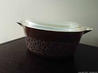 Side view of Pyrex Woodland casserole with lid