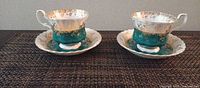 Two teacup and saucer sets front view