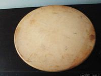 Top view of seasoned Pampered Chef pizza stone