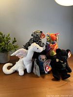 Group view of all five Beanie Babies with tags visible