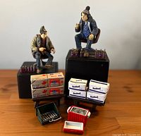 Overall set showing figures seated with accessories arrayed