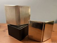 Two cigarette cases stacked showing overall size and finish